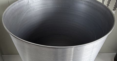 Large Capacity Metal Spinning for Chemical and Food Containers.